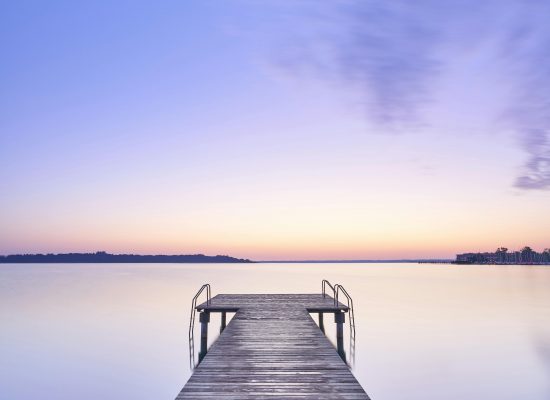 A serene and minimalist visual designed to evoke a sense of deep relaxation and mental clarity, featuring soft lighting and a calming composition suitable for a hypnotherapy environment.